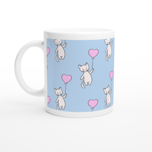mug blanc fond bleu motif chatons blancs ballons roses
